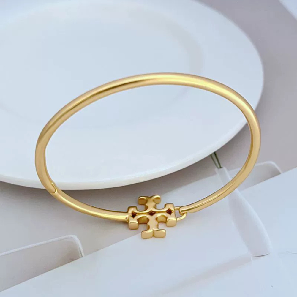 Tory Burch Matte Letter Metal Open Bangle - Picture 2 of 6